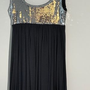 charcoal, gray scoop neck, balloon dress. Silver sequinned empir top , flirty ti